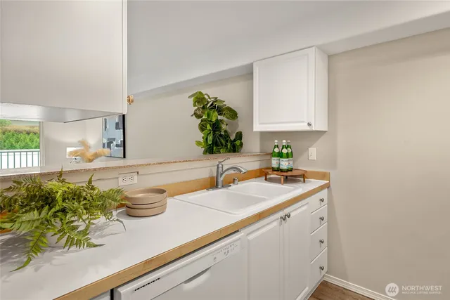 a kitchen with a sink and cabinets