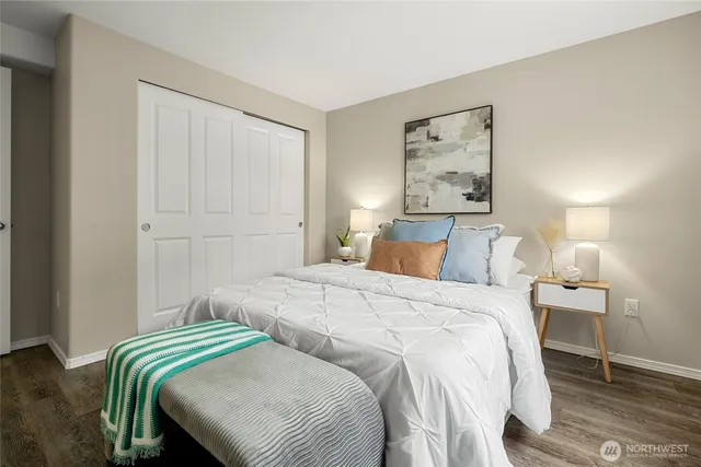 a bedroom with two beds and two night stand