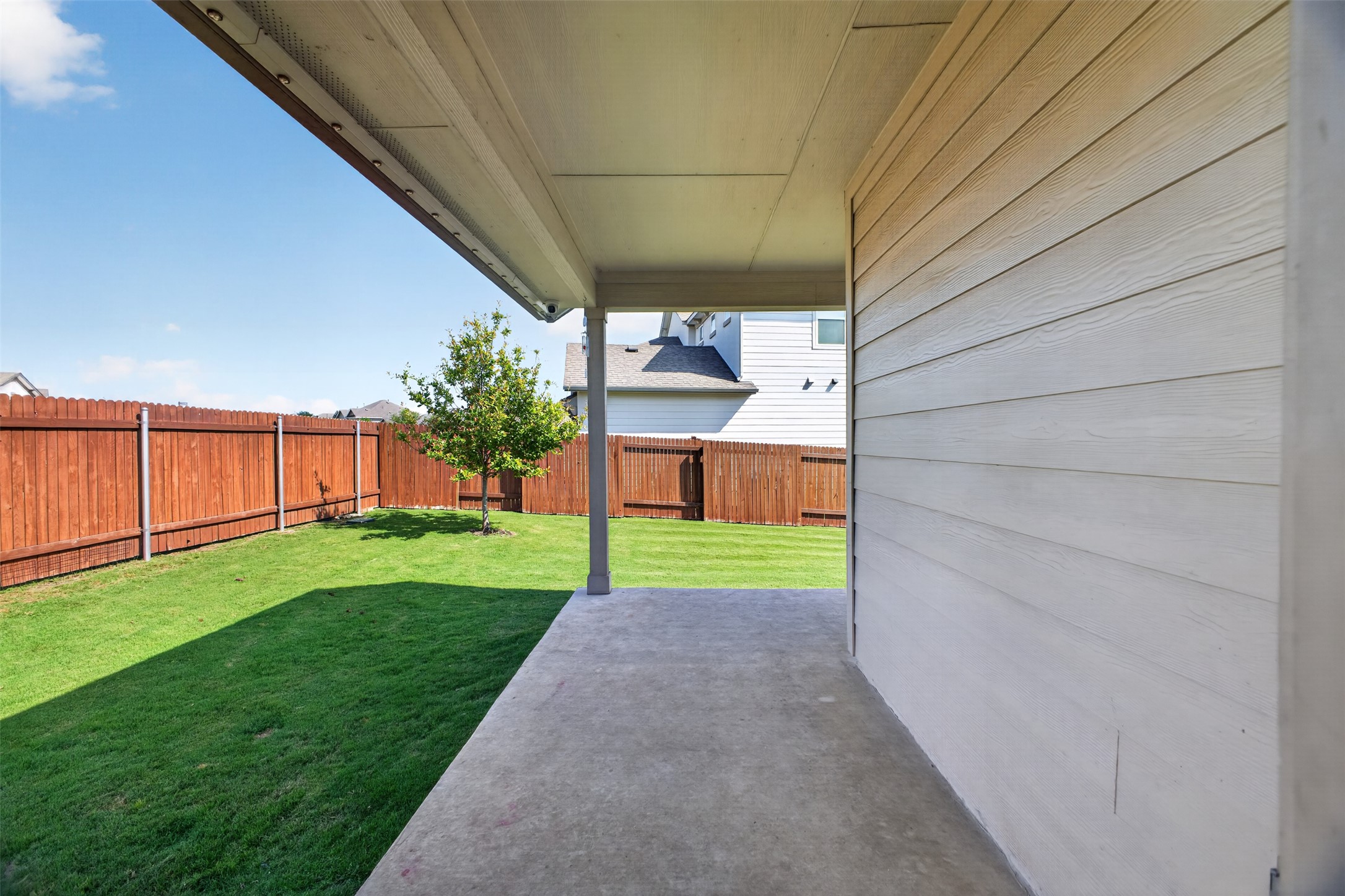 1009 Bright Star Cove Georgetown, TX 78628 - Photo 27 of 40 a view of a backyard with a garden