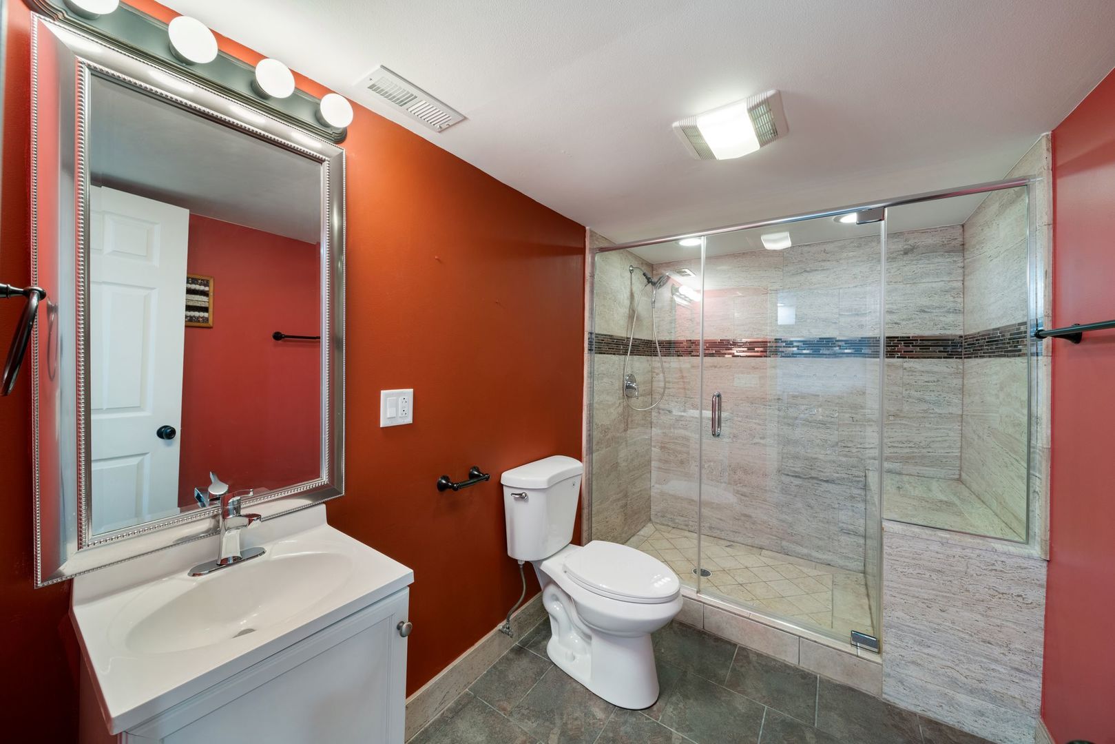 701 Oakton Street Park Ridge, IL 60068 - Photo 46 of 59 a bathroom with a sink mirror toilet and shower