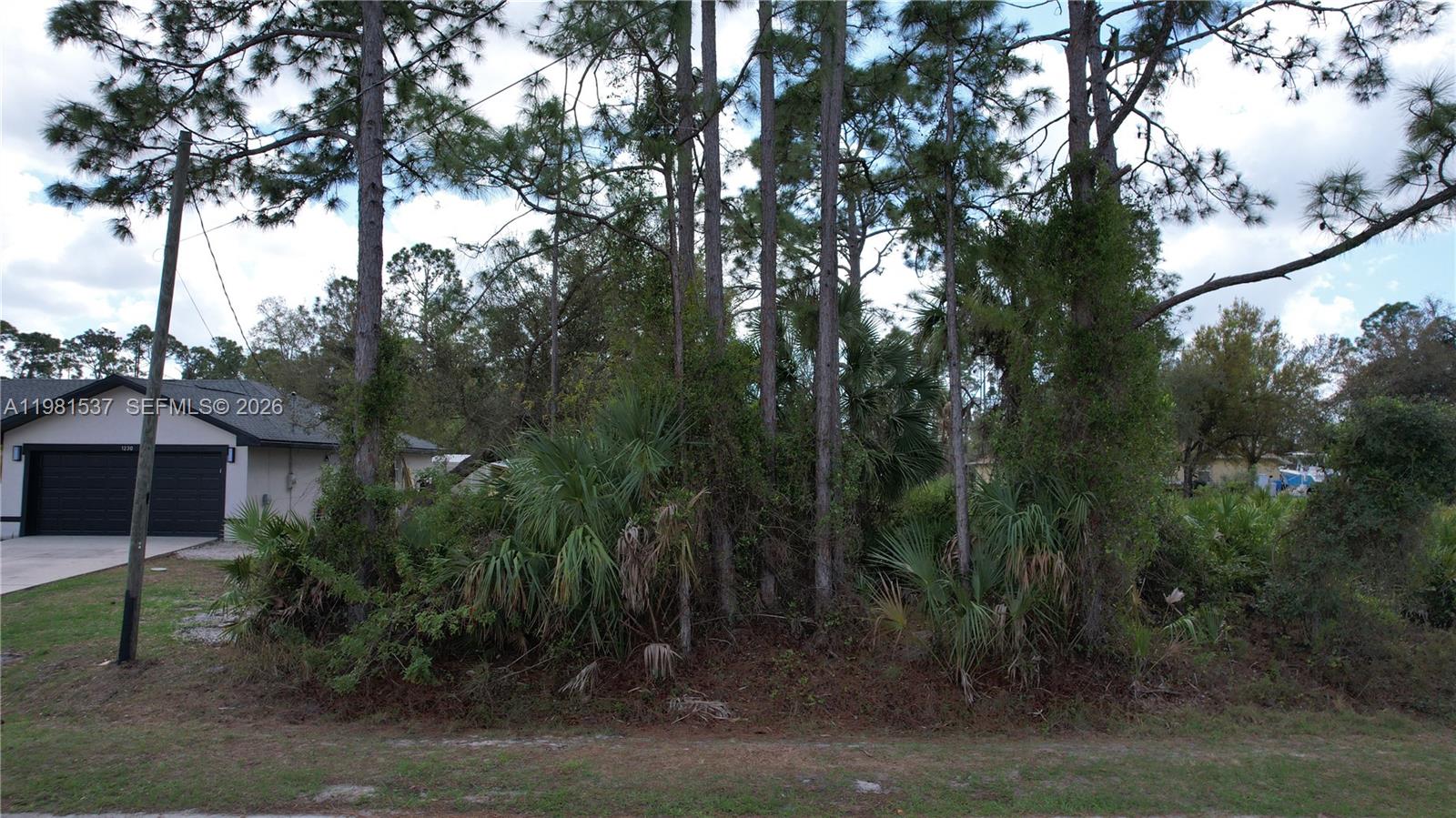 0 Gantry Road North Port, FL 34288 - Photo 25 of 26 a view of a house with a tree
