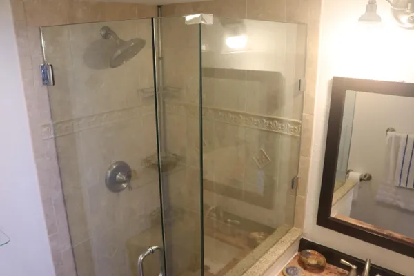 a bathroom with a shower and a sink