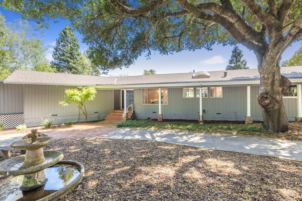 1975 Portola Road Woodside, CA 94062 - Photo 1 of 49 a view of a house with a yard