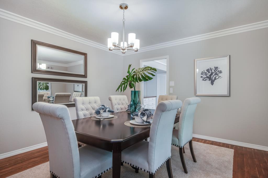 1975 Portola Road Woodside, CA 94062 - Photo 11 of 49 a view of a dining room with furniture wooden floor and chandelier
