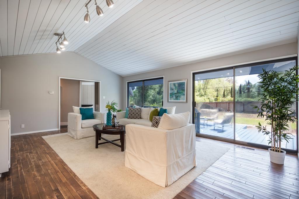 1975 Portola Road Woodside, CA 94062 - Photo 20 of 49 a living room with furniture and a large window with wooden floor