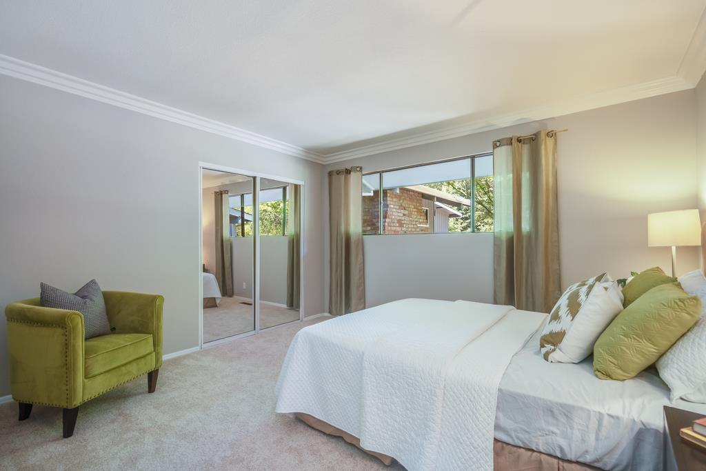 1975 Portola Road Woodside, CA 94062 - Photo 22 of 49 a bedroom with a bed and a couch