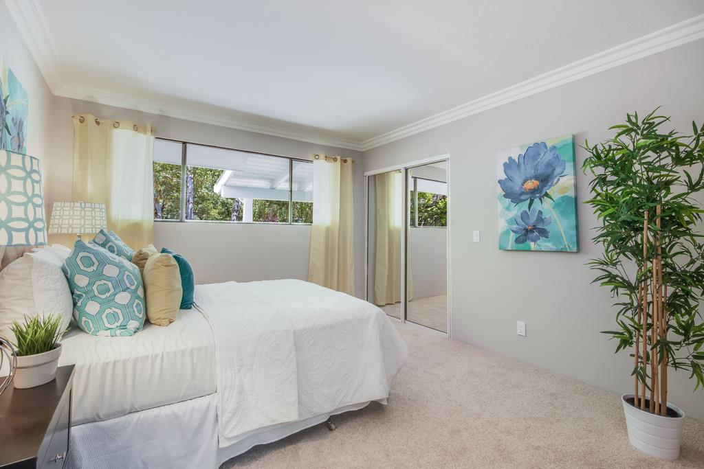 1975 Portola Road Woodside, CA 94062 - Photo 25 of 49 a bedroom with a large bed and a potted plant