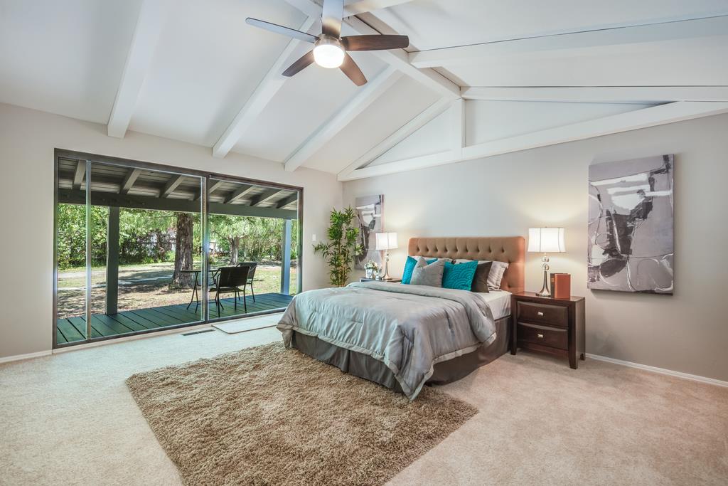 1975 Portola Road Woodside, CA 94062 - Photo 26 of 49 a bedroom with a large bed and a large window
