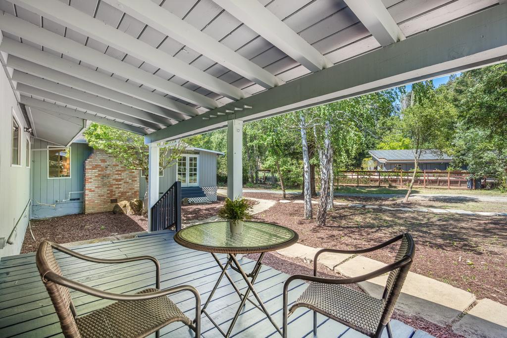 1975 Portola Road Woodside, CA 94062 - Photo 27 of 49 a patio with yard glass top table and chairs