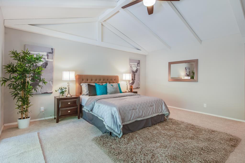 1975 Portola Road Woodside, CA 94062 - Photo 29 of 49 a bedroom with a bed and a potted plant