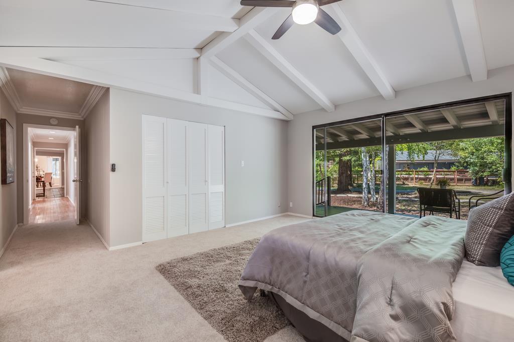 1975 Portola Road Woodside, CA 94062 - Photo 30 of 49 a bedroom with a large bed and a large window