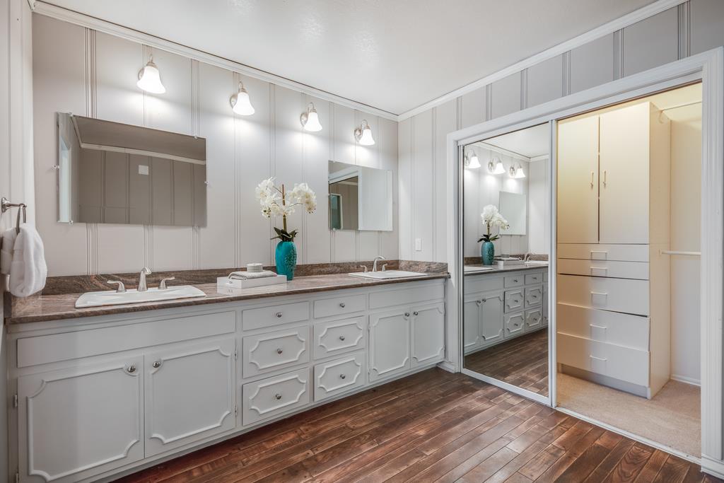 1975 Portola Road Woodside, CA 94062 - Photo 32 of 49 a spacious bathroom with a double vanity sink and a mirror