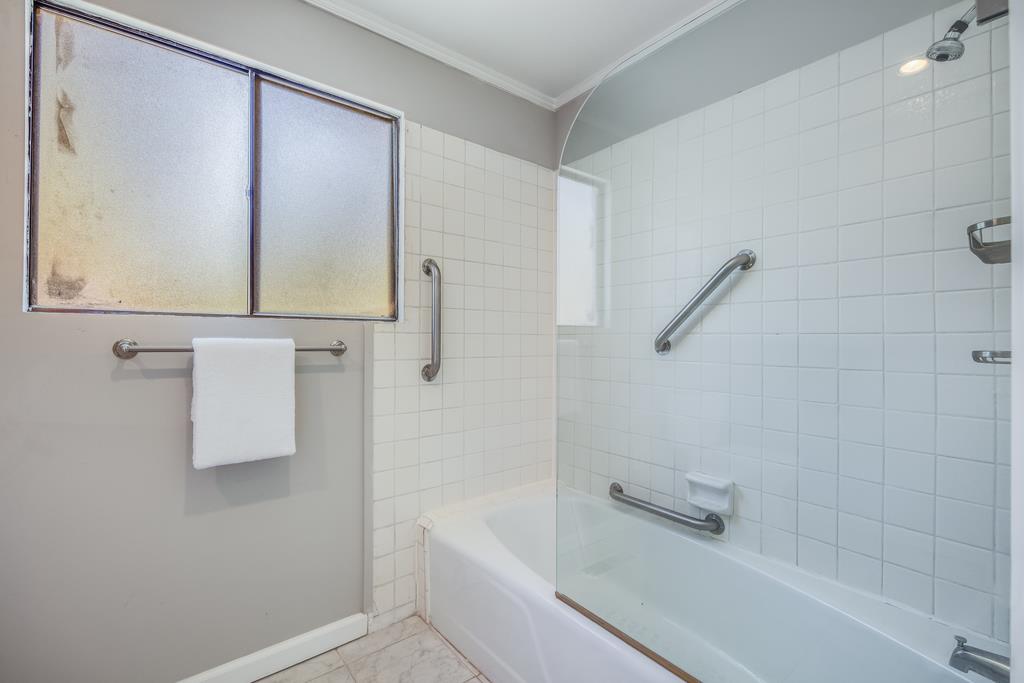 1975 Portola Road Woodside, CA 94062 - Photo 33 of 49 a bathroom with a bathtub and shower