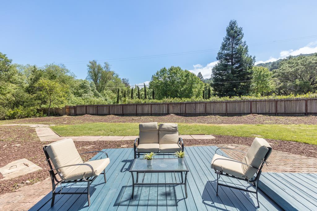 1975 Portola Road Woodside, CA 94062 - Photo 36 of 49 a view of swimming pool with seating and green space