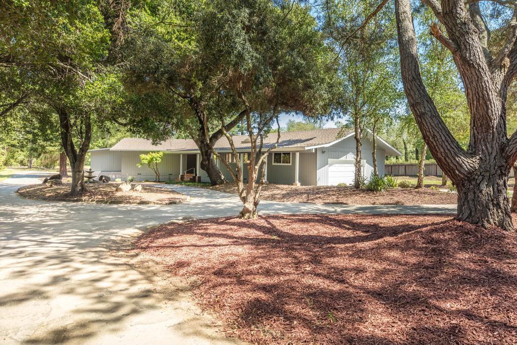 1975 Portola Road Woodside, CA 94062 - Photo 45 of 49 a front view of a house with a yard