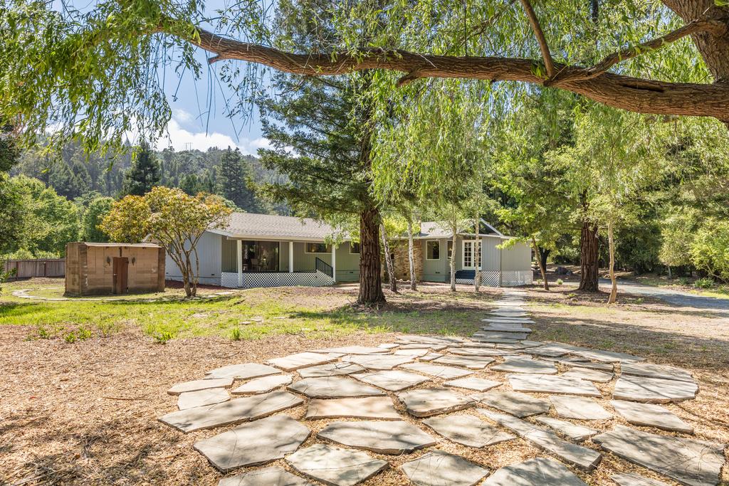 1975 Portola Road Woodside, CA 94062 - Photo 47 of 49 a front view of a house with a yard and trees