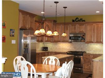 142 Wyndmoor Road Springfield, PA 19064 - Photo 3 of 12 a kitchen with stainless steel appliances granite countertop a stove a sink and a refrigerator