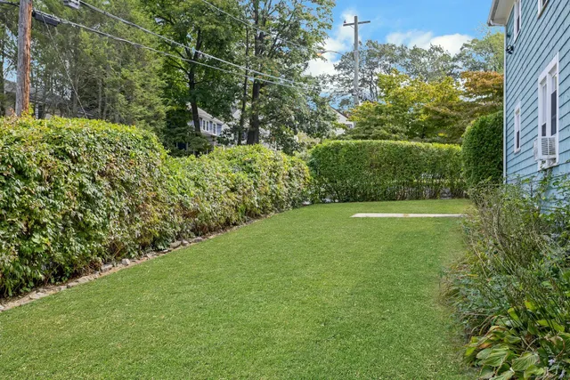 a view of a garden with a building