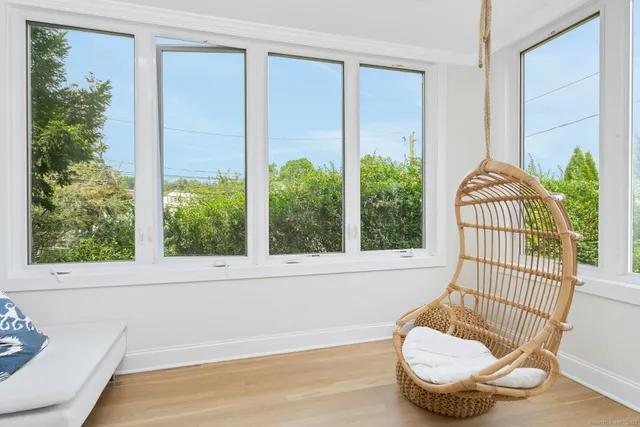 a view of a chair and glass window