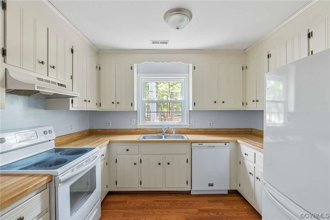 6501 Brambleton Road Chesterfield, VA 23832 - Photo 12 of 18 a kitchen with a sink dishwasher and white cabinets with wooden floor