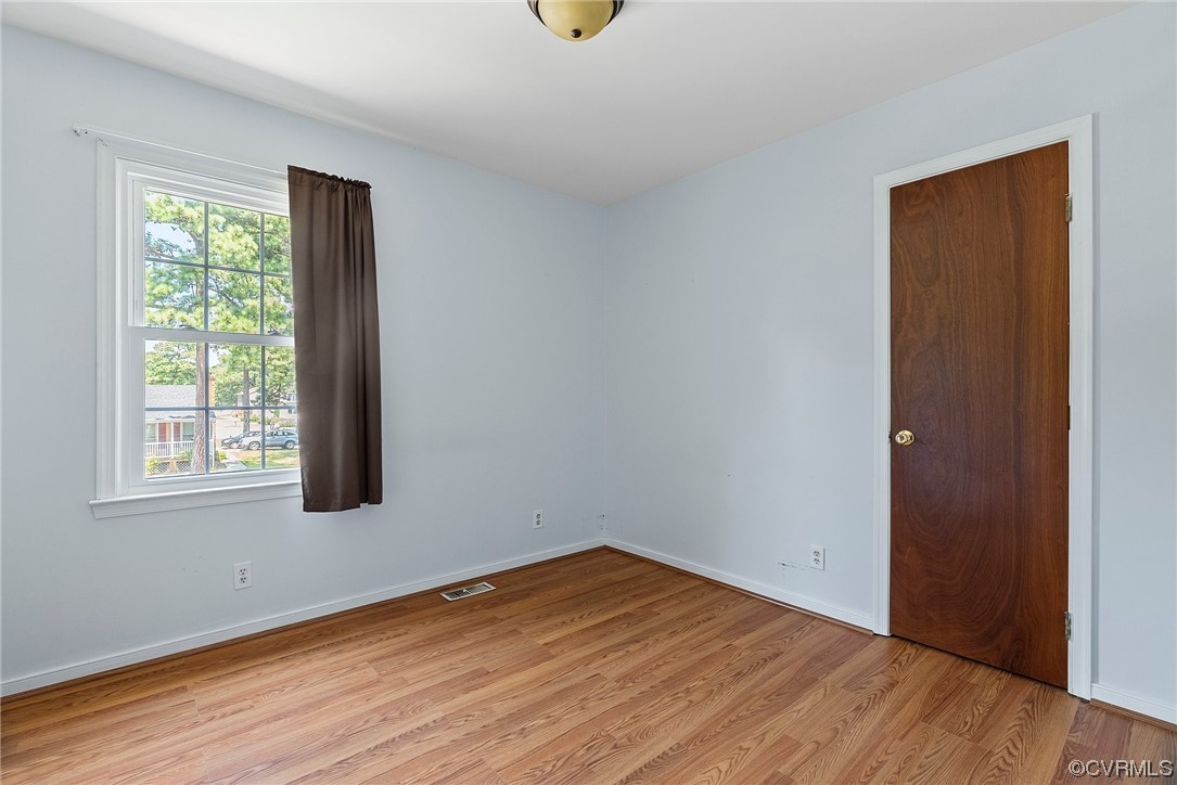 6501 Brambleton Road Chesterfield, VA 23832 - Photo 13 of 18 an empty room with wooden floor and windows