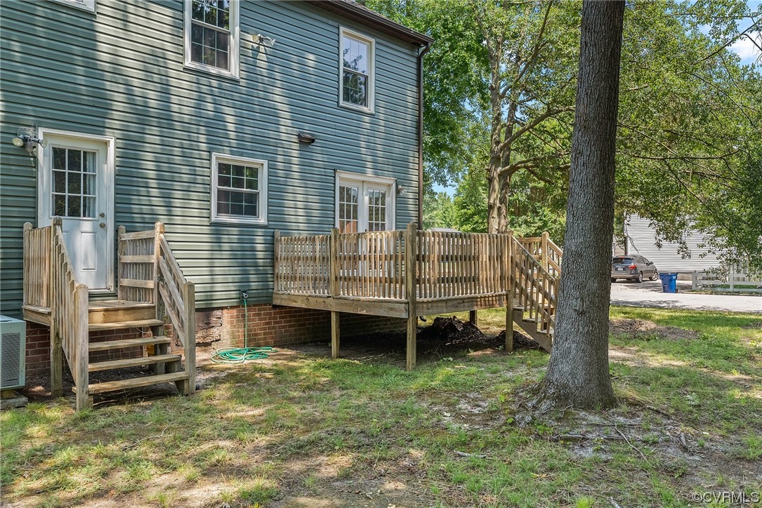 6501 Brambleton Road Chesterfield, VA 23832 - Photo 3 of 18 a backyard of a house with barbeque and wooden fence