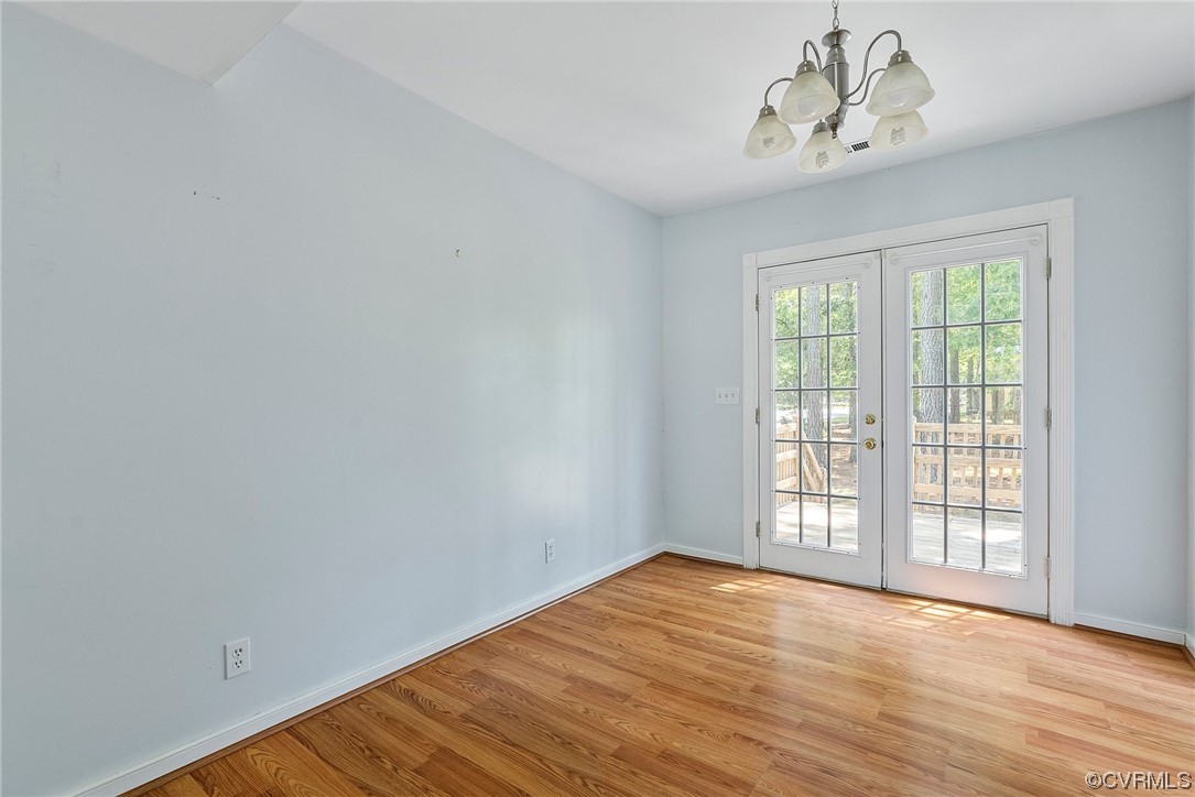 6501 Brambleton Road Chesterfield, VA 23832 - Photo 10 of 18 wooden floor in an empty room with a window