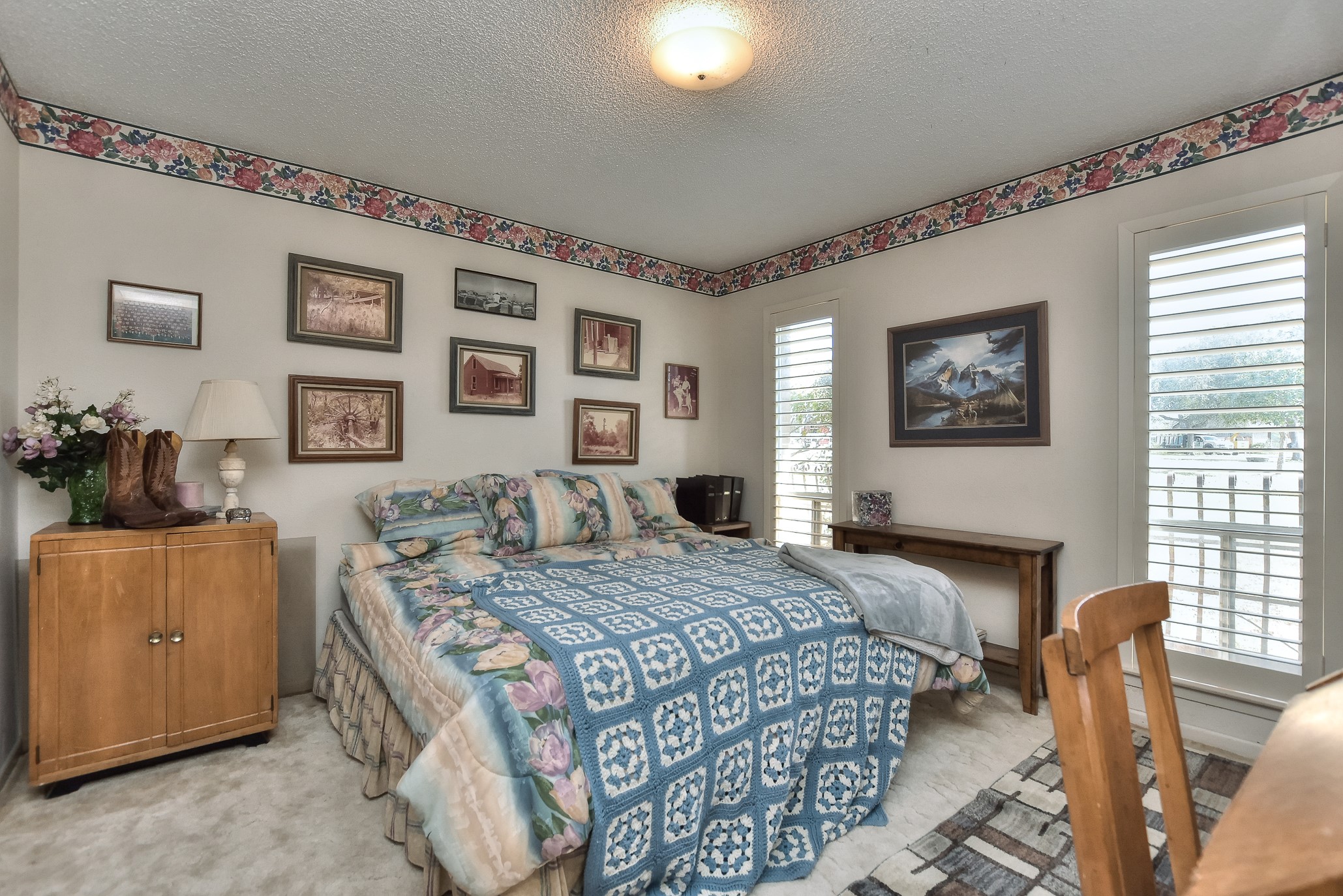 118 Oak Ridge Circle Georgetown, TX 78628 - Photo 30 of 38 a bedroom with a bed and wooden floor
