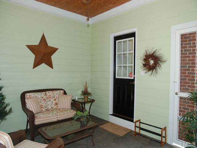 1005 Farnsworth Road Wake Forest, NC 27587 - Photo 19 of 25 The charming breezeway is an adorable covered sitting area with ceiling fan. Other