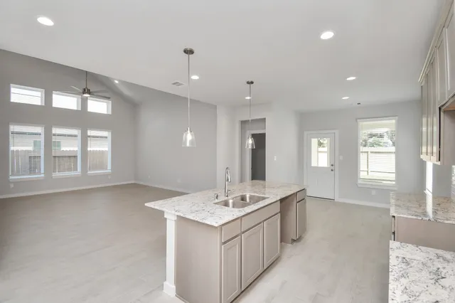 a bathroom with a sink vanity and mirror