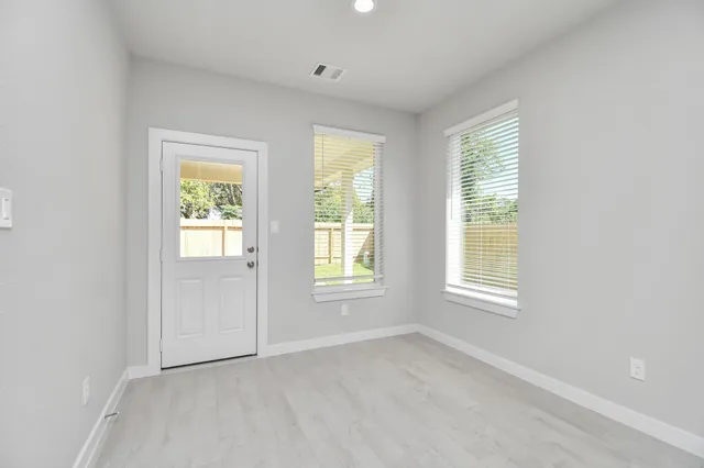 an empty room with windows