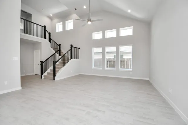 a view of an empty room with stairs