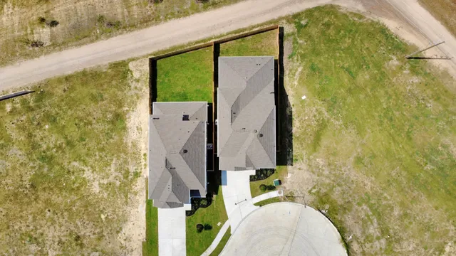 a bathroom with a granite countertop shower and a sink