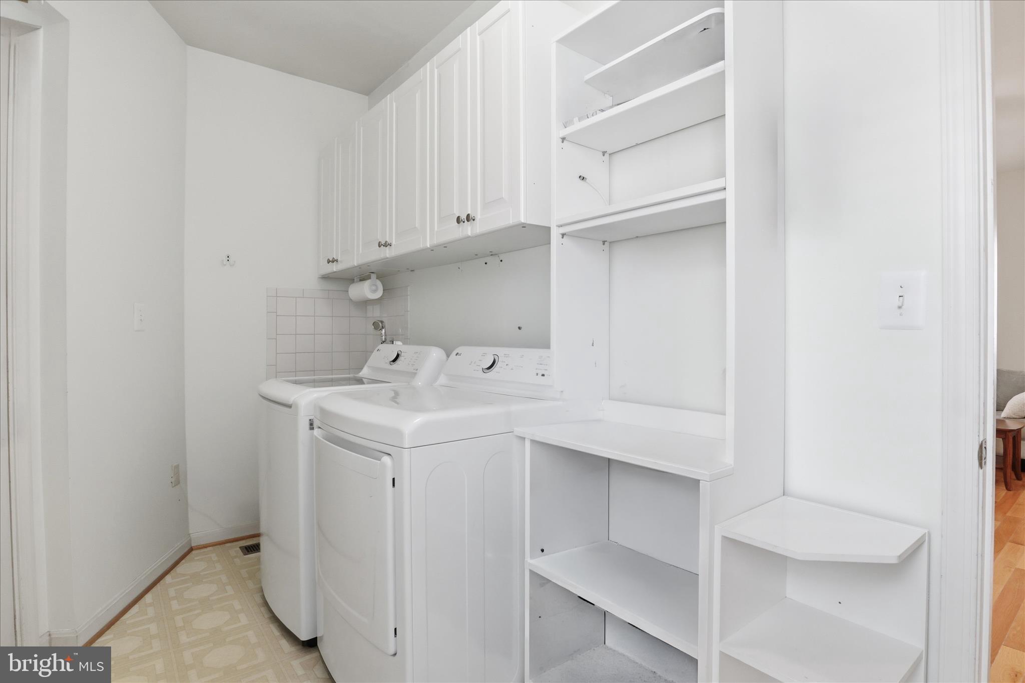 25352 Ripleys Field Drive Chantilly, VA 20152 - Photo 15 of 54 a utility room with cabinets washer and dryer