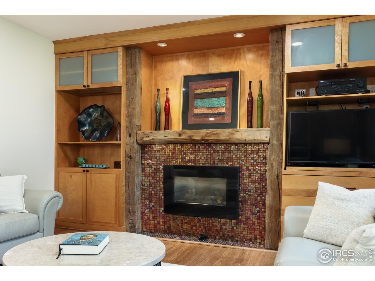 7459 Mt Meeker Road Longmont, CO 80503 - Photo 18 of 37 Family room gas fireplace and built-ins!