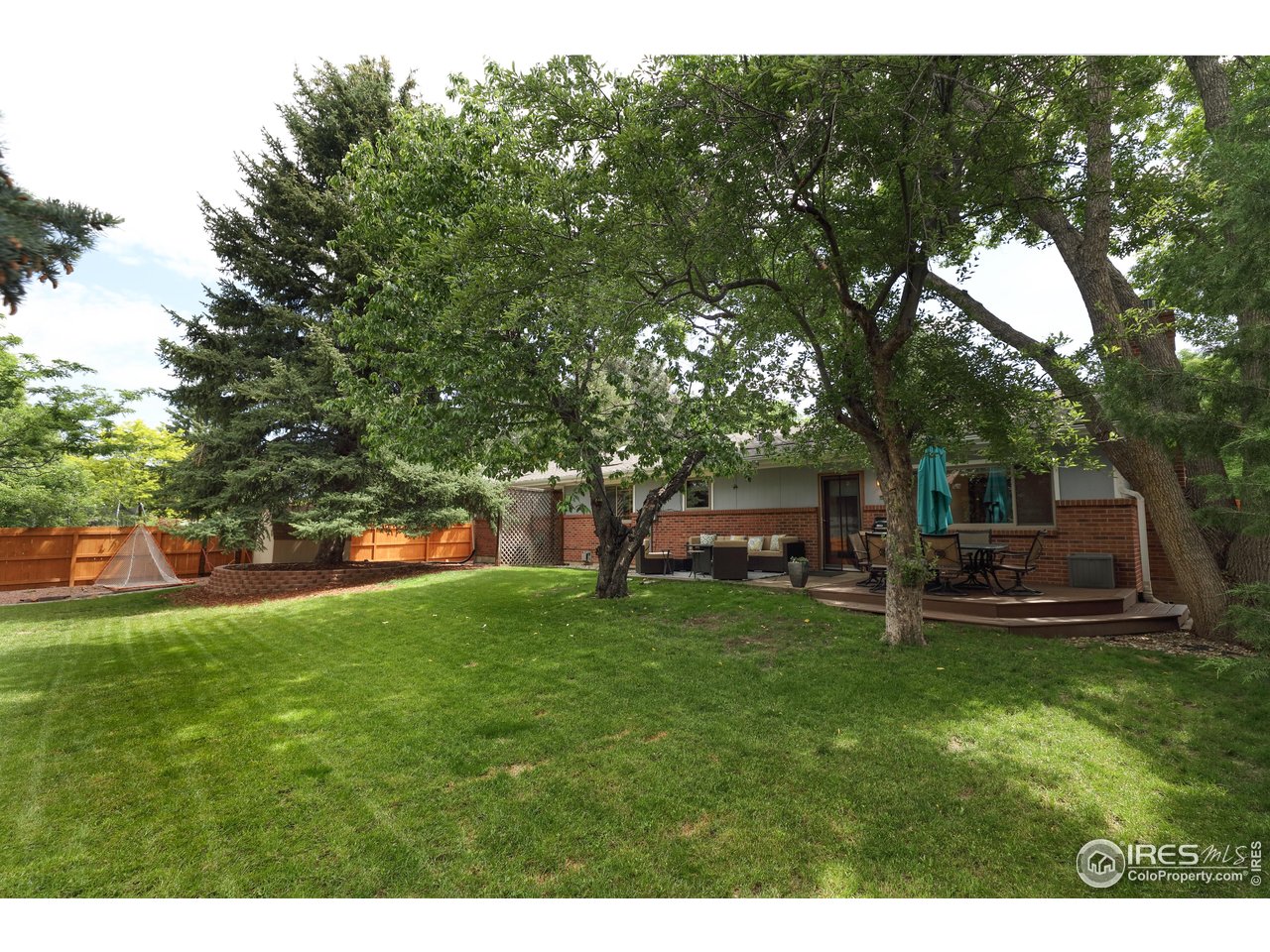 7459 Mt Meeker Road Longmont, CO 80503 - Photo 5 of 37 Huge back yard with mature trees.