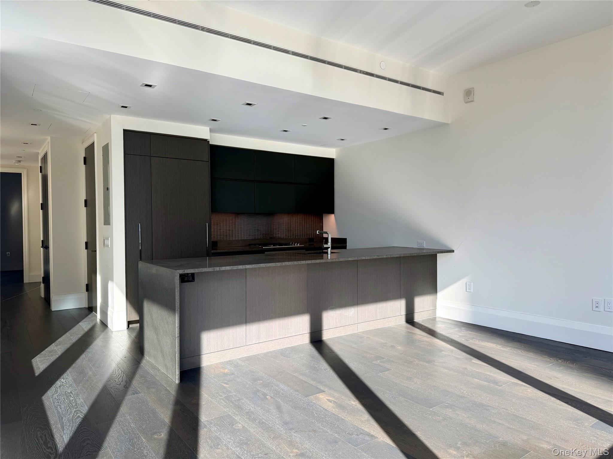 172 Madison Avenue, Unit 17C Manhattan, NY 10016 - Photo 15 of 27 a living room with a flat screen tv and a rug