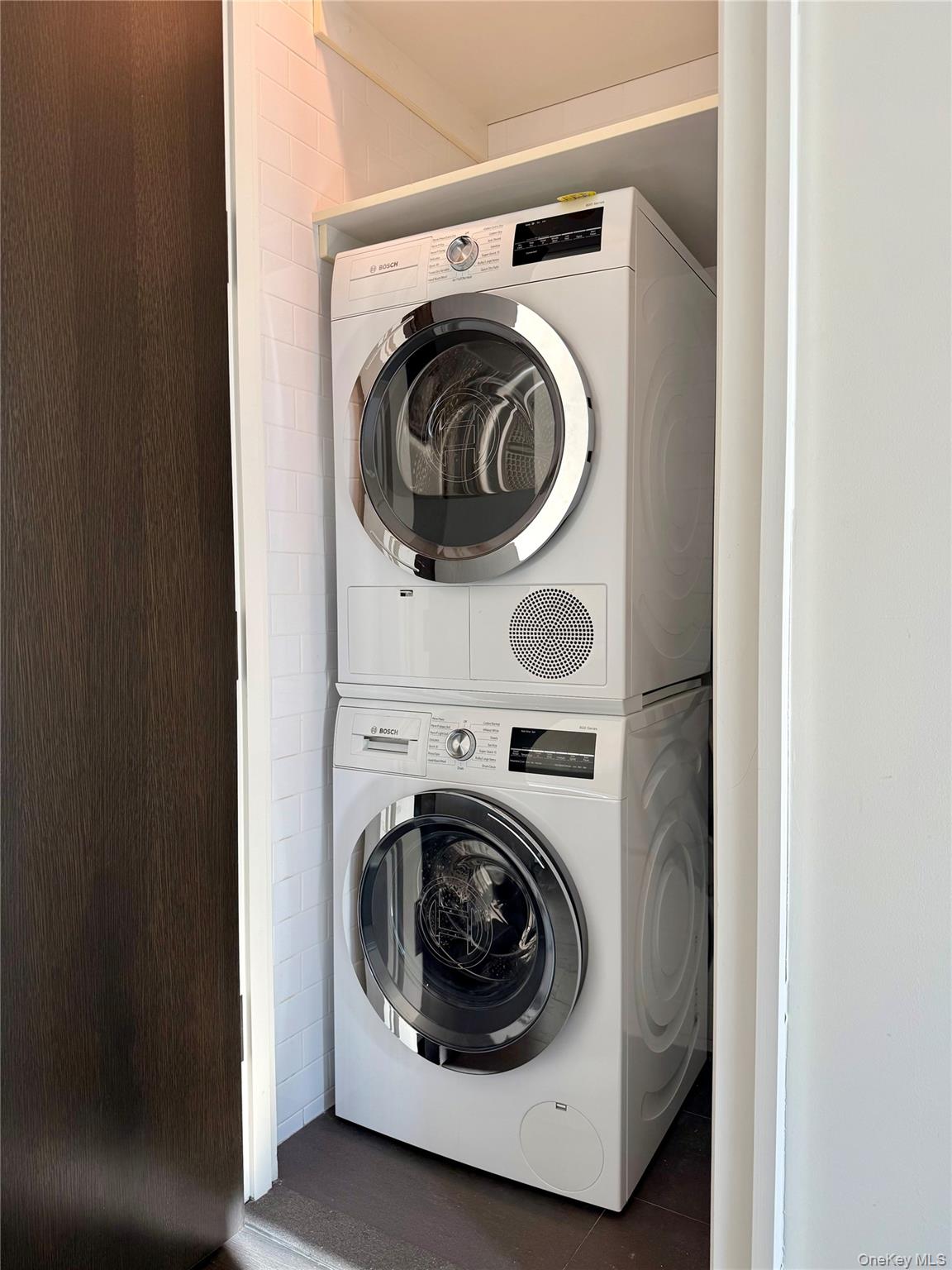 172 Madison Avenue, Unit 17C Manhattan, NY 10016 - Photo 18 of 27 a utility room with dryer and washer