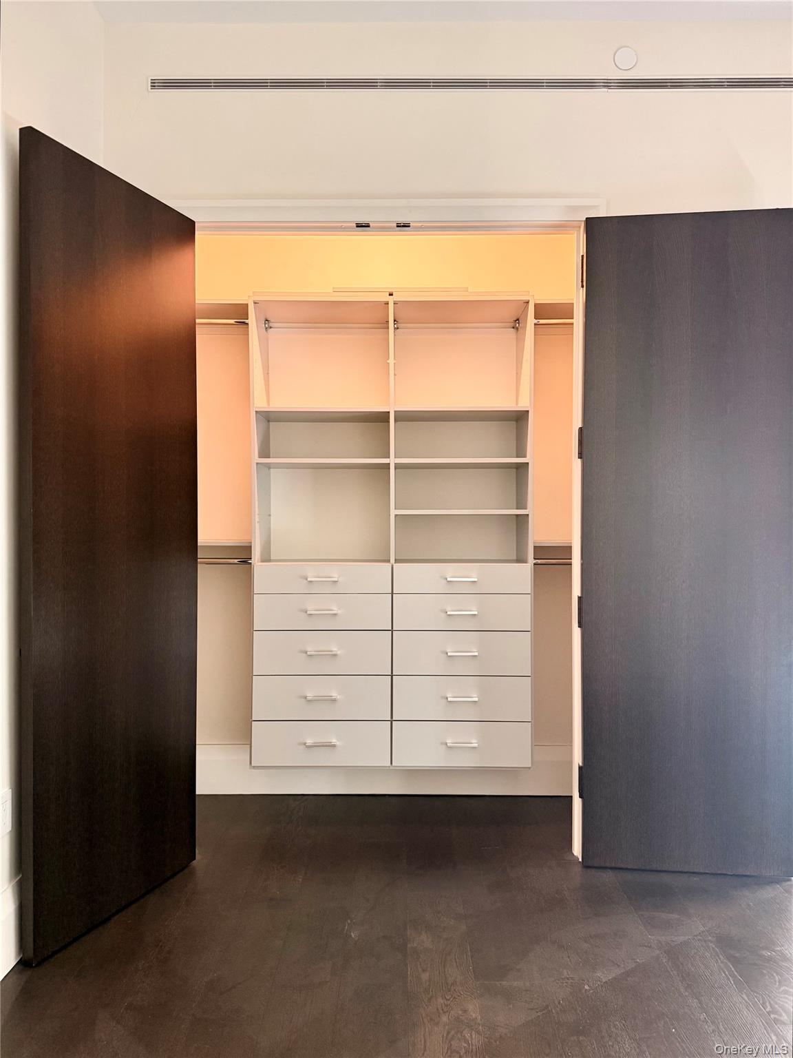 172 Madison Avenue, Unit 17C Manhattan, NY 10016 - Photo 24 of 27 a view of an empty room with cabinet and a window