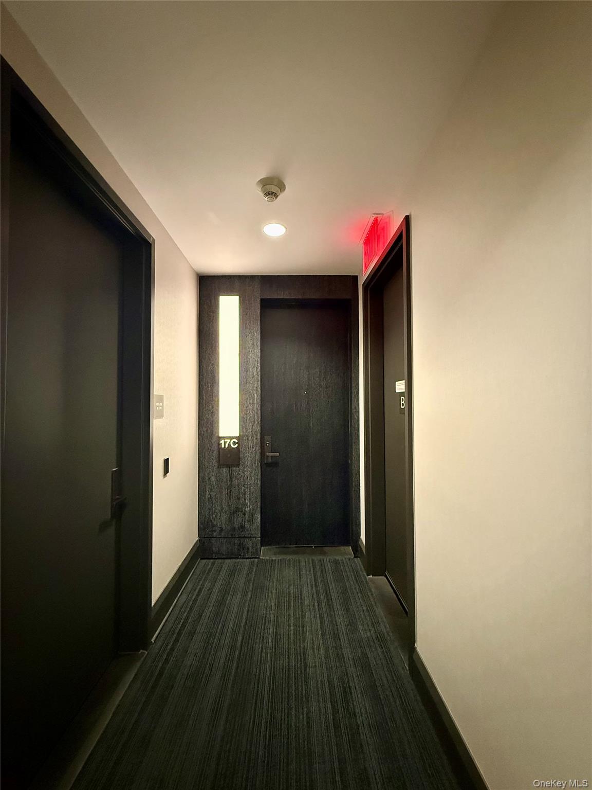 172 Madison Avenue, Unit 17C Manhattan, NY 10016 - Photo 7 of 27 a view of a hallway with wooden floor
