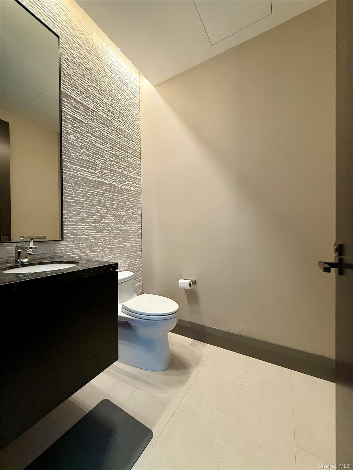 172 Madison Avenue, Unit 17C Manhattan, NY 10016 - Photo 9 of 27 a bathroom with a toilet and a sink