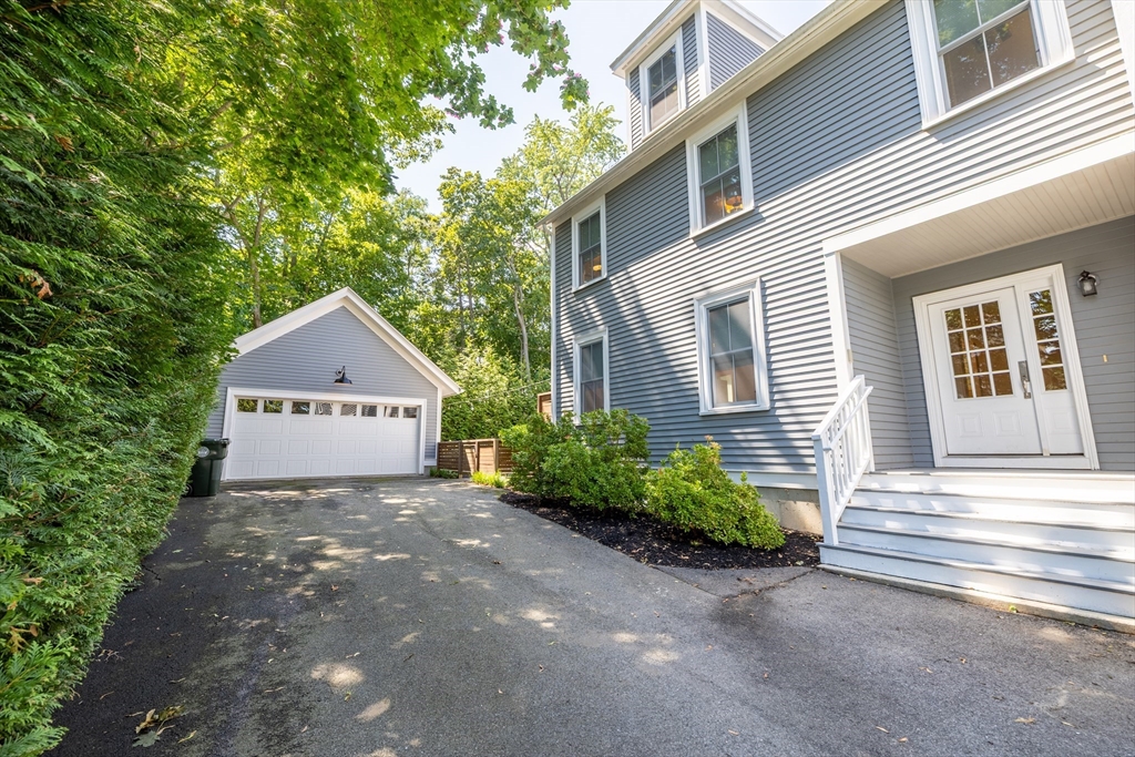 31 Bartlet Street Andover, MA 01810 - Photo 3 of 6 a view of a house with a yard and plants