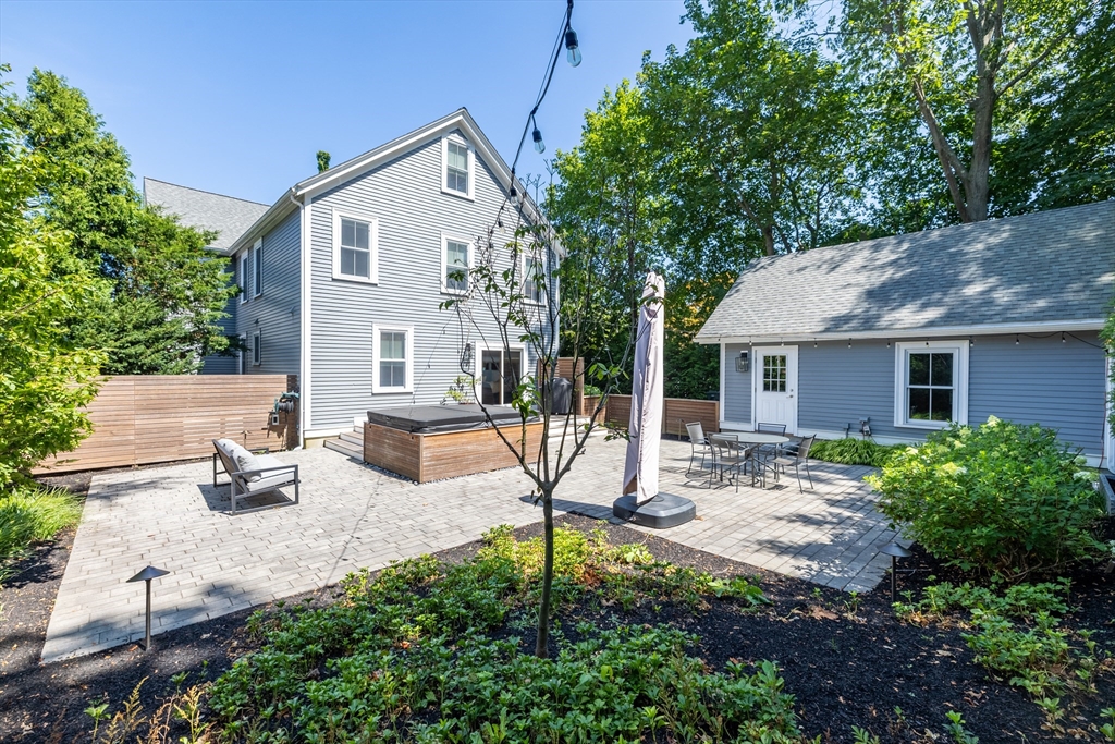 31 Bartlet Street Andover, MA 01810 - Photo 5 of 6 a view of a house with backyard sitting area and porch
