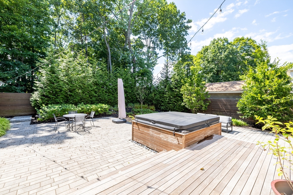 31 Bartlet Street Andover, MA 01810 - Photo 6 of 6 a wooden bench sitting in the middle of a backyard