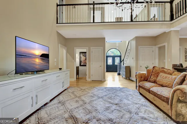 a kitchen with stainless steel appliances kitchen island granite countertop a refrigerator and a cabinets