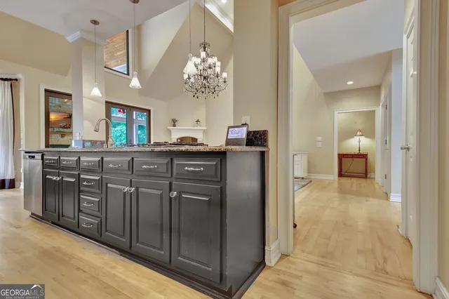 a dining room with furniture and a chandelier