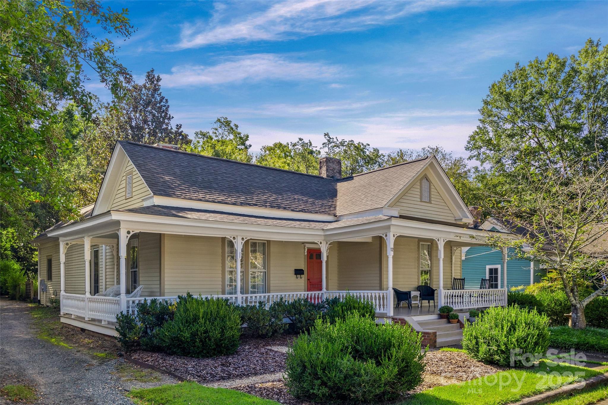 a front view of a house with garden