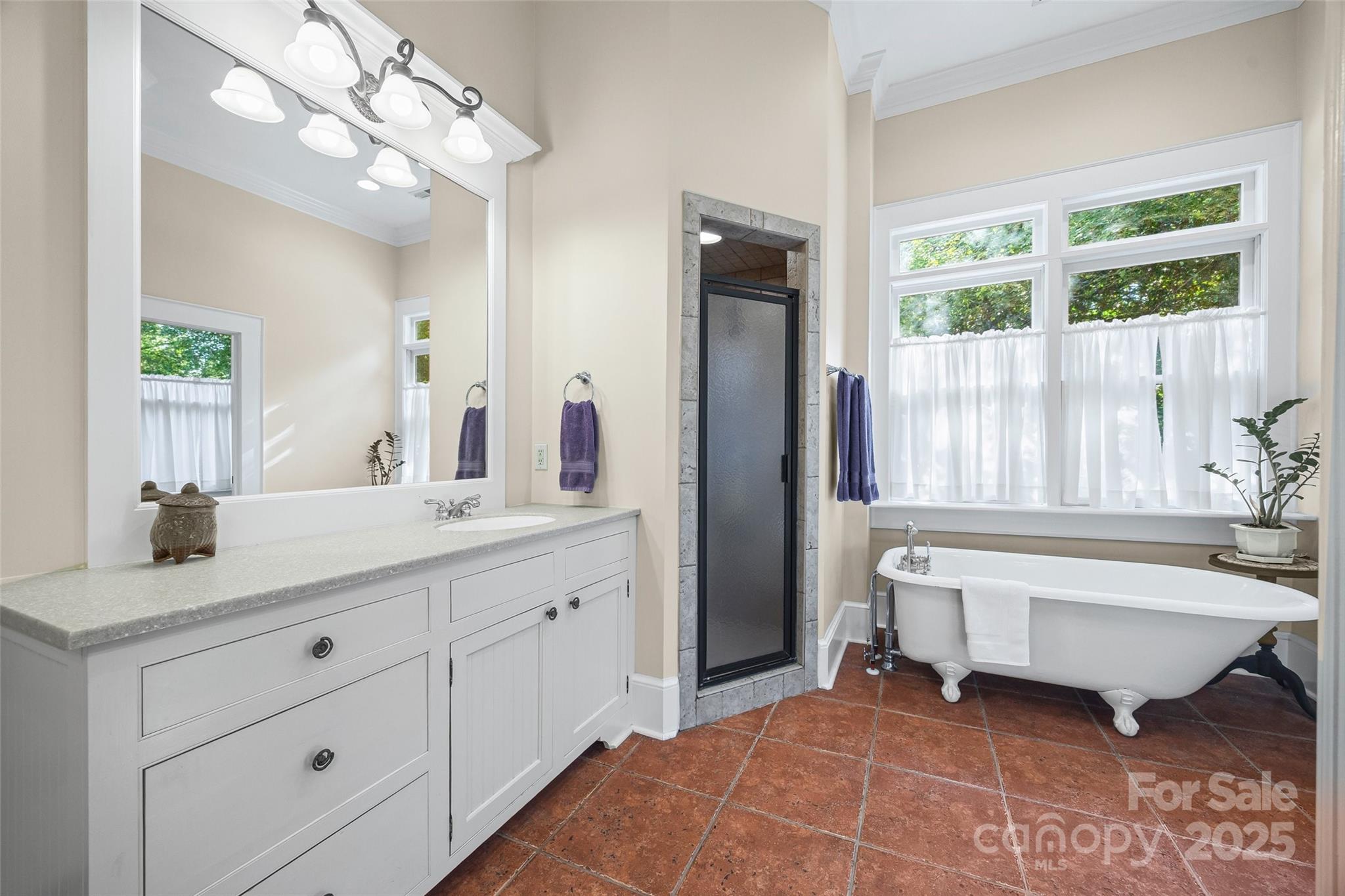 12 Wright Avenue York, SC 29745 - Photo 16 of 29 a spacious bathroom with a double vanity sink a mirror a bathtub and a window