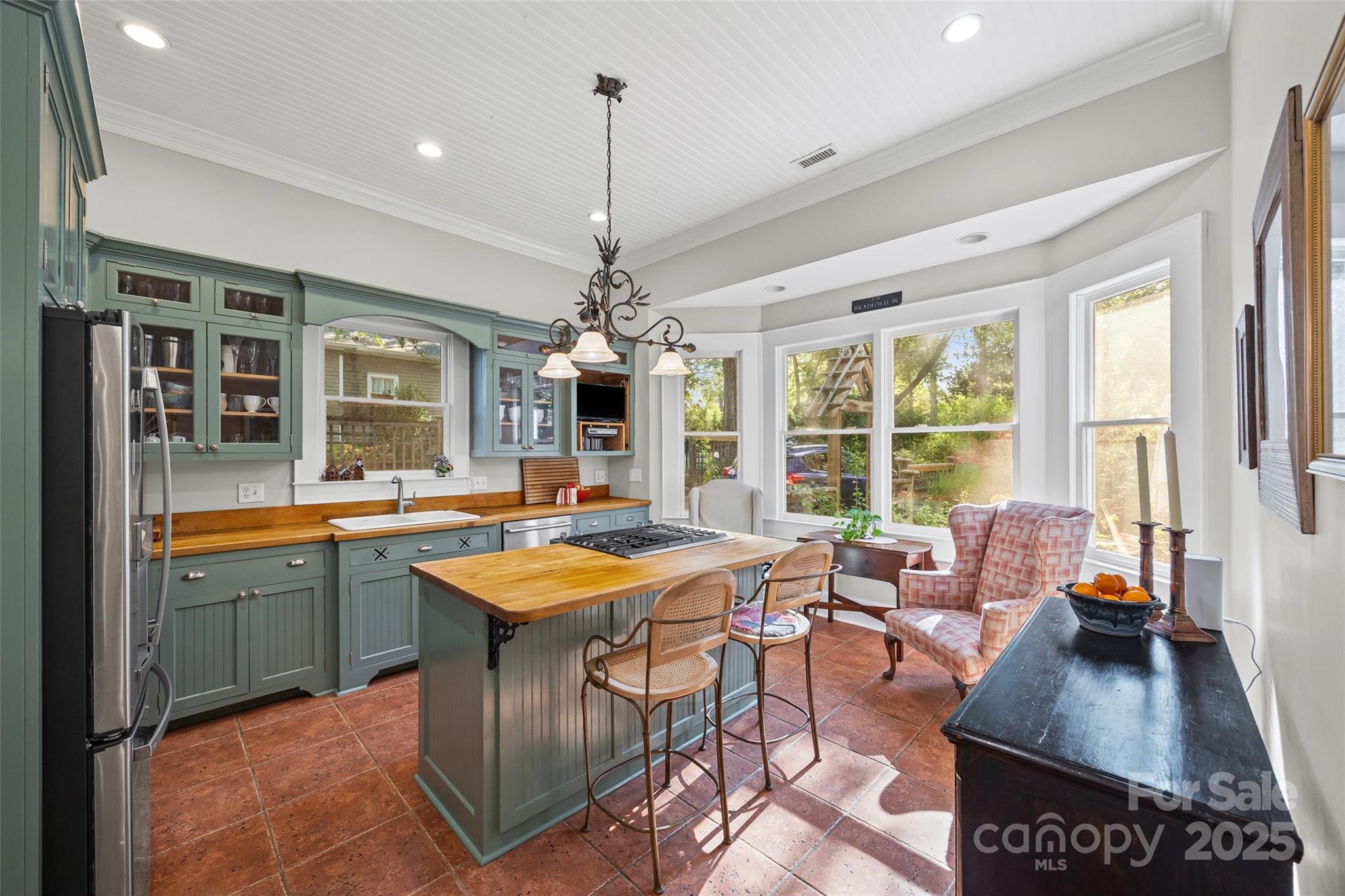 12 Wright Avenue York, SC 29745 - Photo 22 of 29 a kitchen with stainless steel appliances granite countertop a stove and a view of dining hall with couches