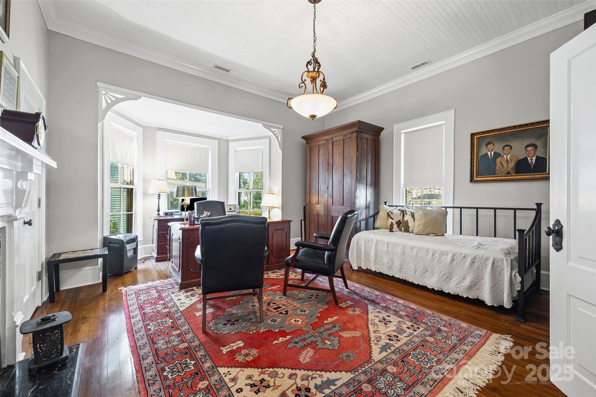 12 Wright Avenue York, SC 29745 - Photo 9 of 29 a living room with furniture a rug and a chandelier